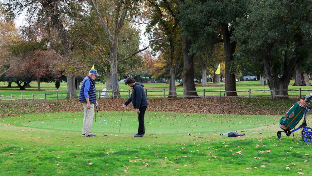 Golf lesson at William Land Golf Course putting green in Sacramento