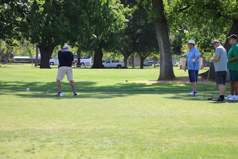 Group of golfers teeing off at William Land Golf Course in Sacramento