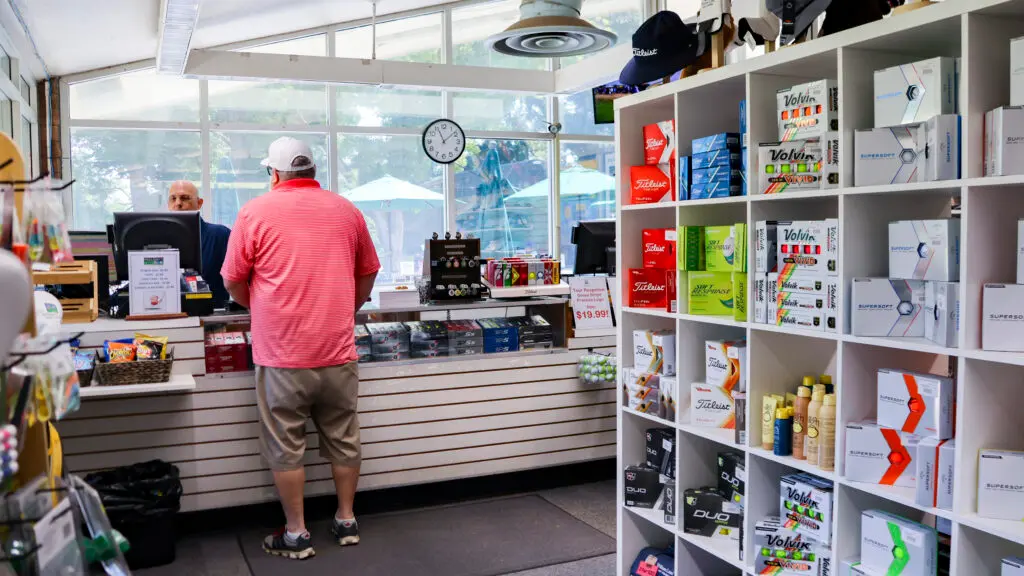 William Land Golf Course pro shop interior with golf gear and checkout counter