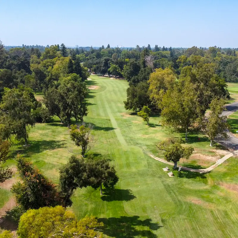 Aerial view of William Land Golf Course fairway and tree-lined layout in Sacramento