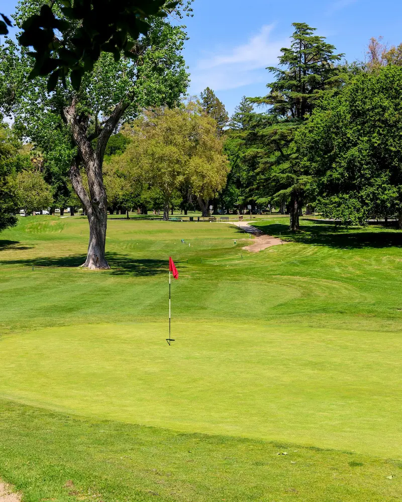 Putting green with red flag at William Land Golf Course in Sacramento