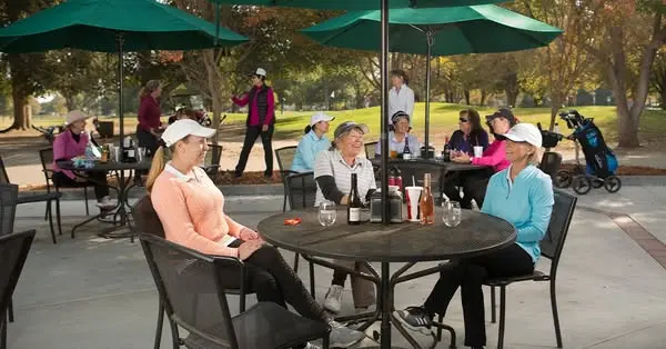 Golfers dining outdoors at William Land Golf Course patio in Sacramento
